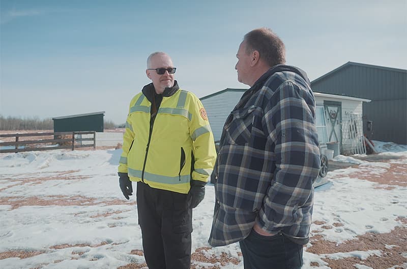 County Fire Chief Randy Schroeder chats with a landowner.